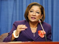 Trinidad and Tobago's Prime Minister Kamla Persad-Bissessar addresses a news conference in Port of Spain