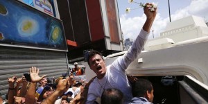 Venezuelan opposition leader Leopoldo Lopez gets into a National Guard armored vehicle in Caracas