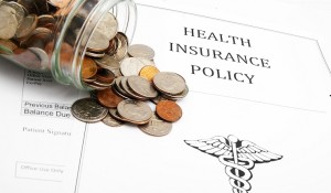 insurance policy and coins