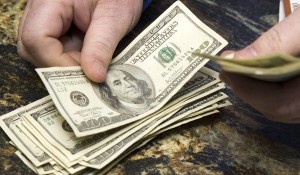 Dan Demeglio, race and sports book supervisor, cashes a 200-to-1 future bet for Doug O'Neill, trainer of Kentucky Derby winner I'll Have Another, at the Primm Valley Casino in Primm