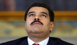 Venezuela's President Nicolas Maduro looks upwards while arriving at a news conference at Miraflores Palace in Caracas