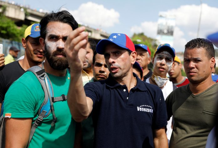 Opposition leader Henrique Capriles gestures during a rally in Caracas, Venezuela