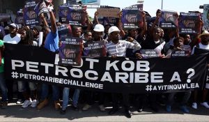 Haitians protest to call for an investigation into the alleged misuse of Venezuela-sponsored PetroCaribe funds by previous administrations, in Port-au-Prince