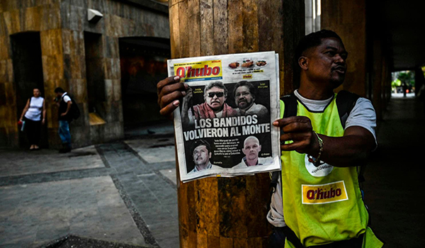 Front pages in Colombia on Aug. 30 led with the news that former FARC leaders were taking up arms again against the government. (Joaquin Sarmiento/AFP/Getty Images)